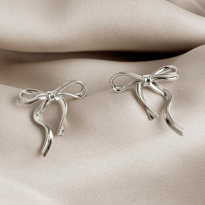 Kit Heath Serenity Ribbon Bow Stud Earrings in Silver